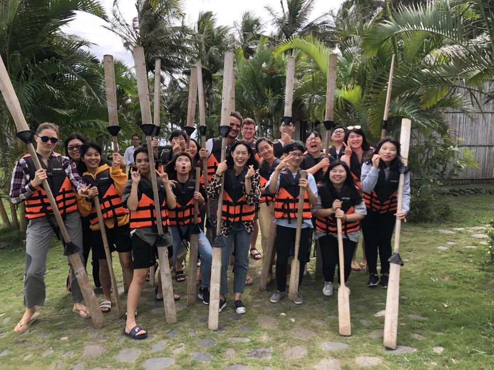 Group photo of international students rafting experience